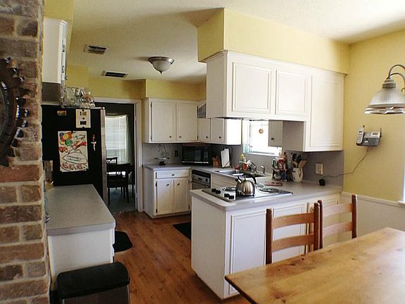 Kitchen and breakfast area with ample counter space.