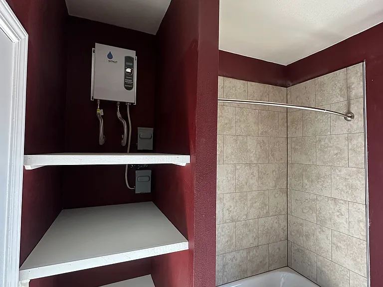 There is instant in line water heater so it's hot as soon as you want to shower.