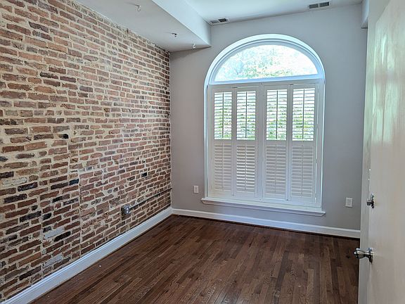 Light filled living room, with 10 ft ceilings.