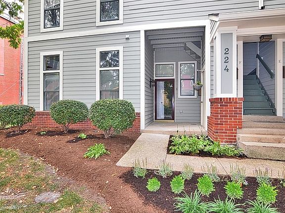 224 E 13th Street, Unit#B, Indianapolis, IN 46202. Fresh landscaping and outdoor storage frame the entry to the condo.