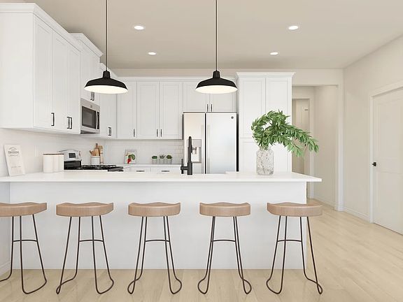 Kitchen with peninsula island and pendant lighting