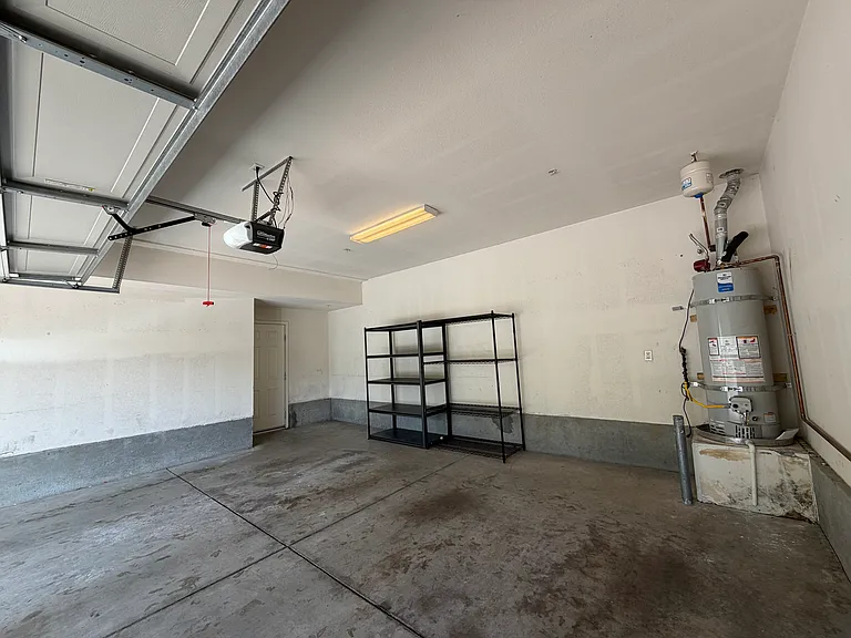Private detached two-car garage with additional storage space.