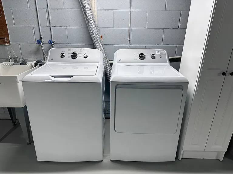 New washer and dryer for your personal use in basement with storage.