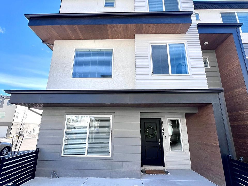 Front of townhome - small patio along greenspace