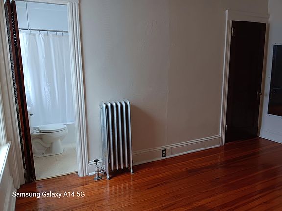 Bedroom reflecting bathroom & closet doors