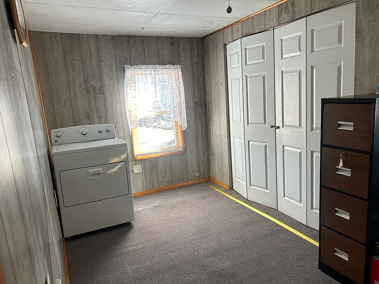 Entryway with dryer and large closet