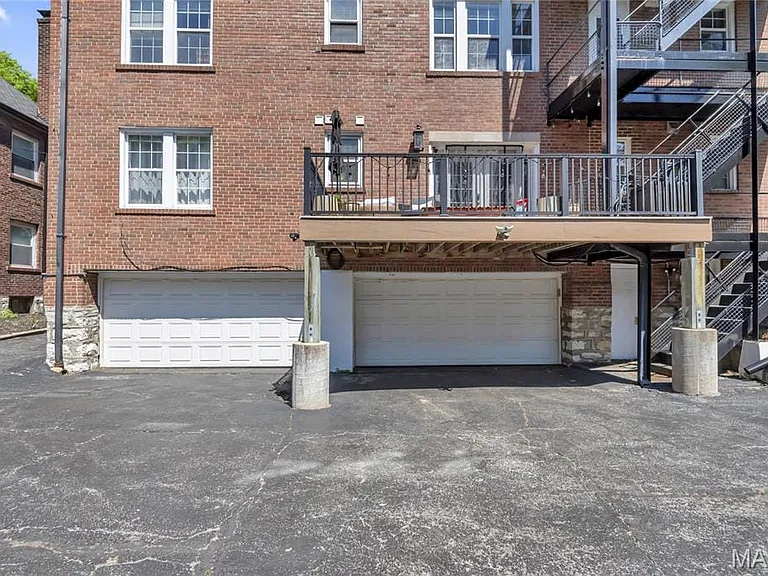 1 stall garage with open and a guest parking spot goes with unit