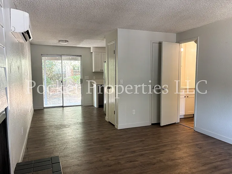 Half bathroom off of living room on main floor, under staircase