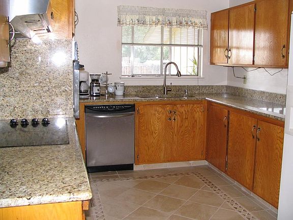 Kitchen with Granite Countertop and Backsplash, Italian Tiles with decorative inlays