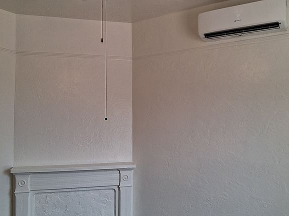 Living Room with Ceiling Fan and Mini Split/AC Heating unit.