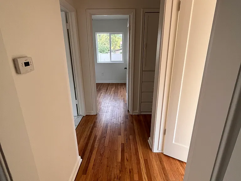 Hallway with built-in storage cupboard