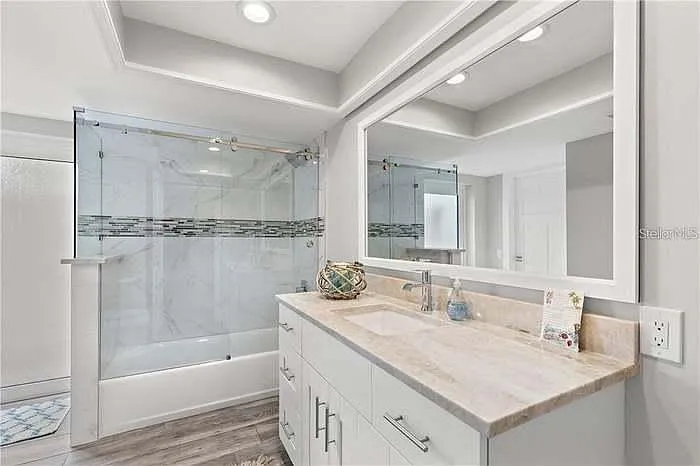 ensuite bathroom to second bedroom with king size bed