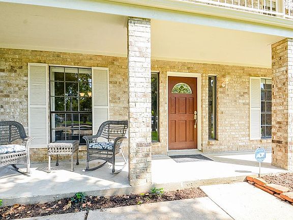How will YOU decorate this spacious porch? Plants? Rocking chairs? Do both. The sky's the limit with a large space like this one... Greet your guests in the shade.
