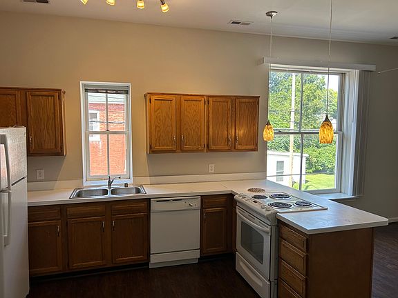 View of kitchen from entry door. Dining area to the right.