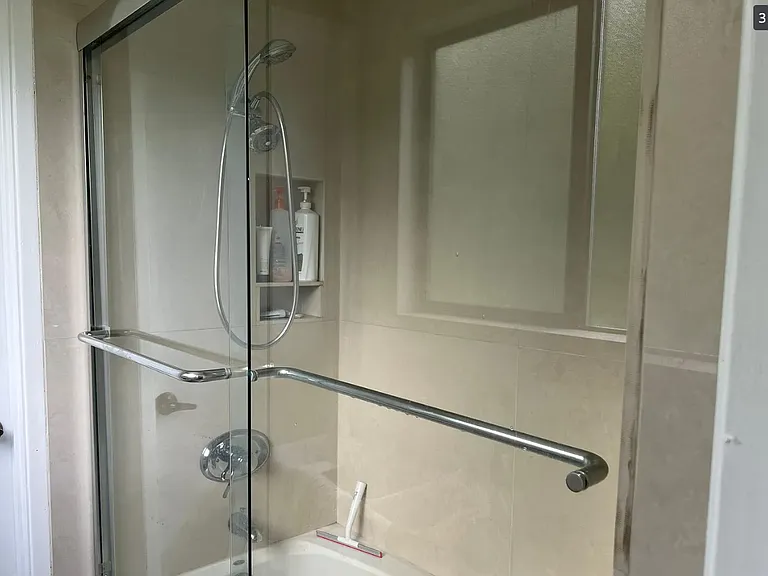 Shower over jacuzzi tub upstairs, located between toilets on the left and right.
