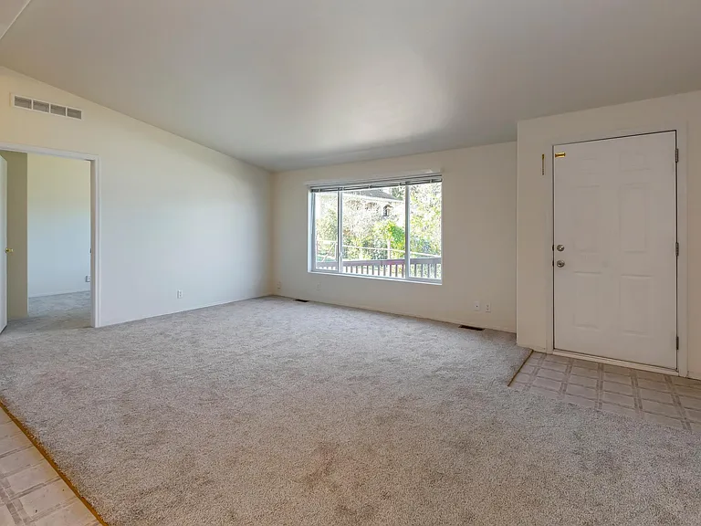 Living room and entry to 2nd bedroom.
