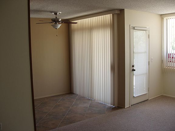 DINING ROOM - TILE FLOOR - CEILING FAN WITH LIGHT - SLIDER TO BALCONY