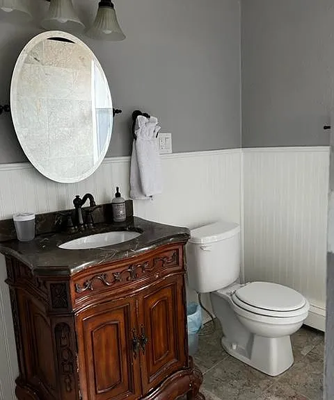 En suite bathroom in bedroom 2 on main level.