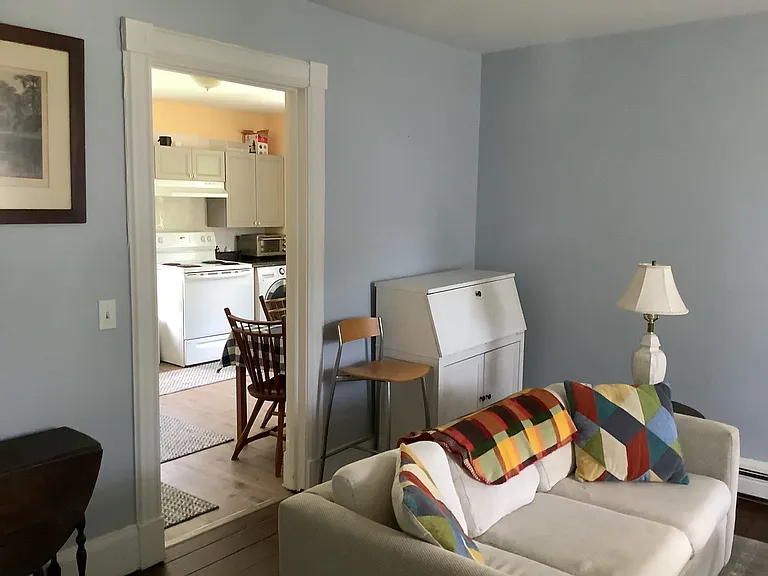Living Room with bright Kitchen beyond