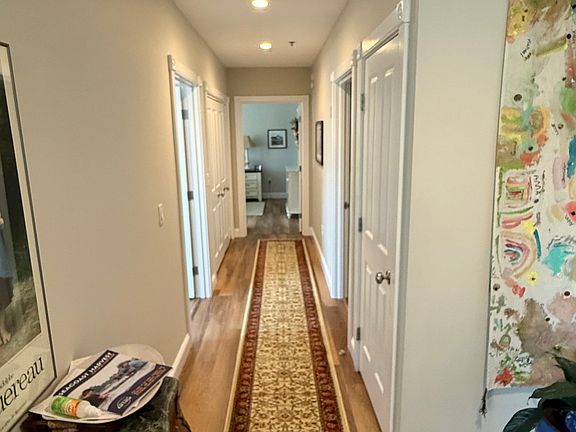 Hallway to your right as you walk in.