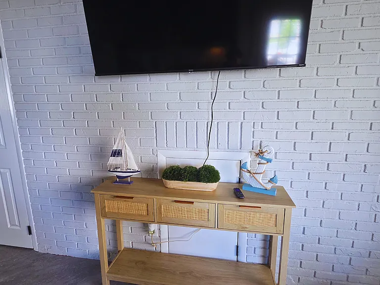 Smart TV for entertainment with beach-style decor table