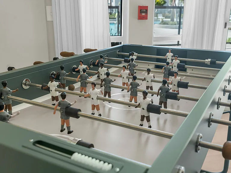 Enjoy vibrant community living with a modern twist - our foosball lounge awaits!