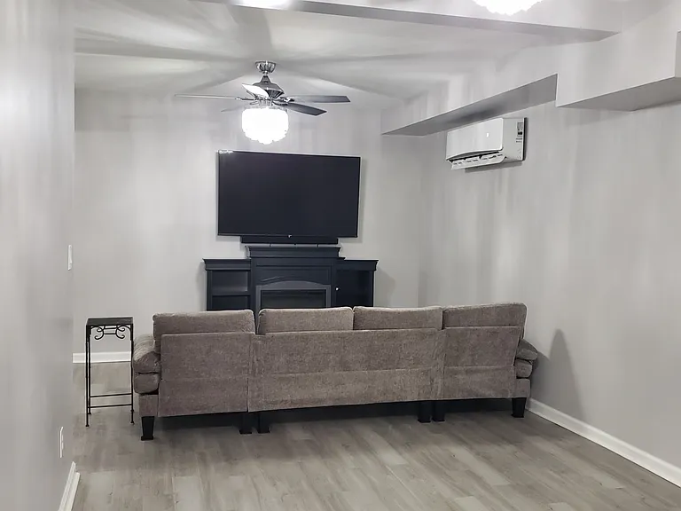 Elegant remote controlled crystal chandelier ceiling fans are located in each area/room.