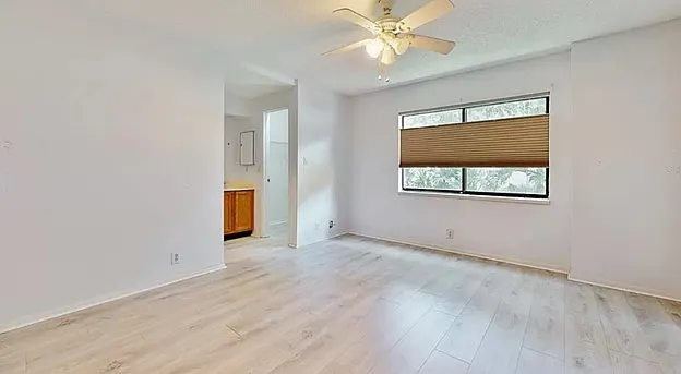 Master Bedroom with bathroom and upgraded window treatments that can move up or down