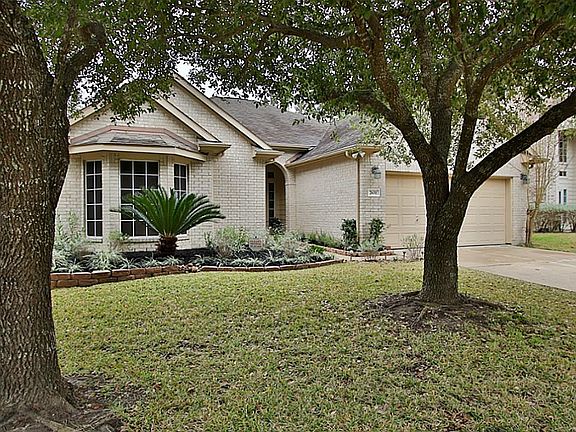 Mature trees flank this beautiful brick home.  Neighborhood is located at Fry & Westheimer Pkwy - making it easy to get to I10 or the Westpark Toll Rd! Low taxes too!