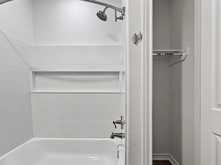 Private ensuite bathroom with modern finishes.