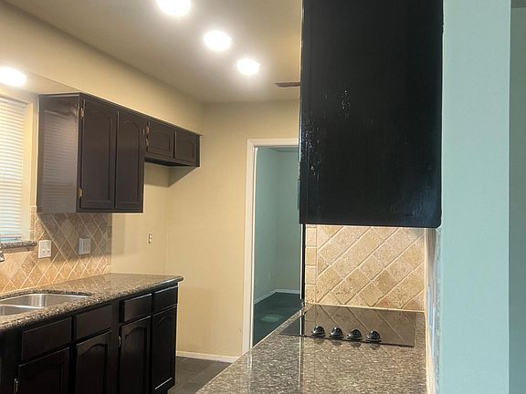 Galley kitchen with recessed lighting