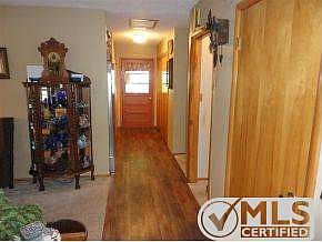 Foyer and hallway with storage