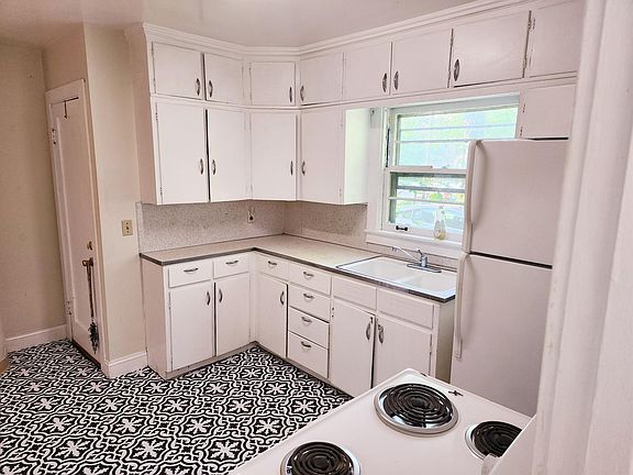 Unit one kitchen. Side door entrance.