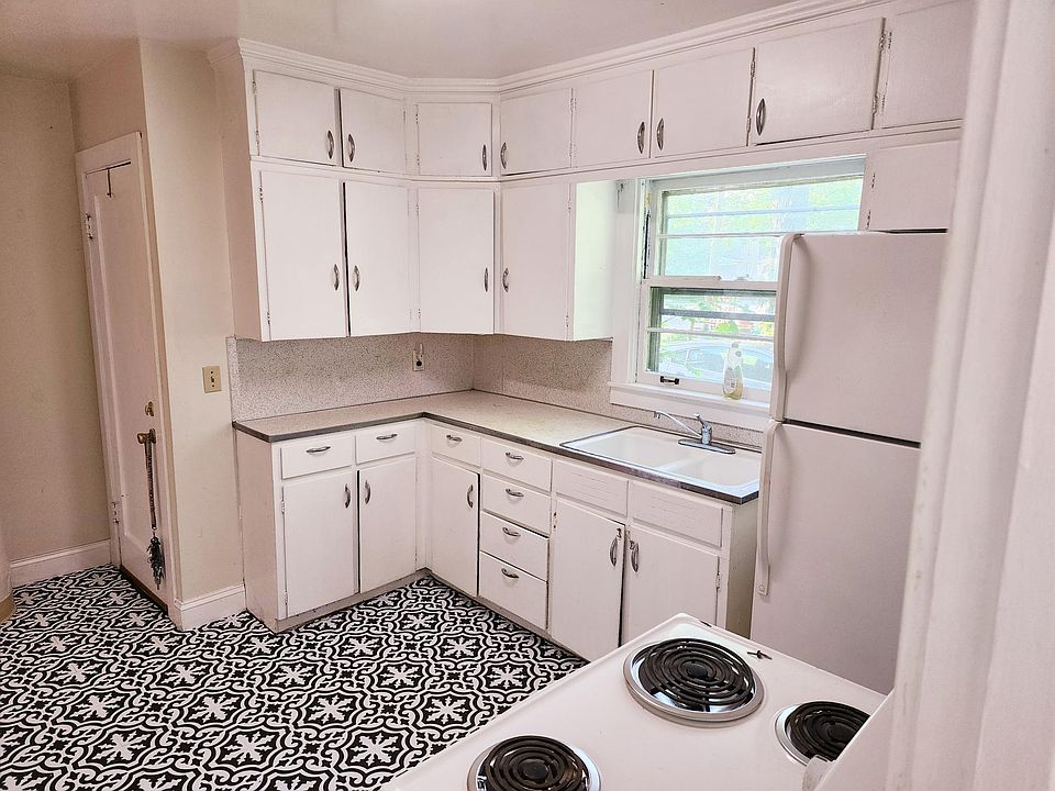 Unit one kitchen. Side door entrance.