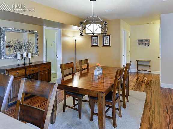 Large Dining area with solid bamboo hardwood flooring