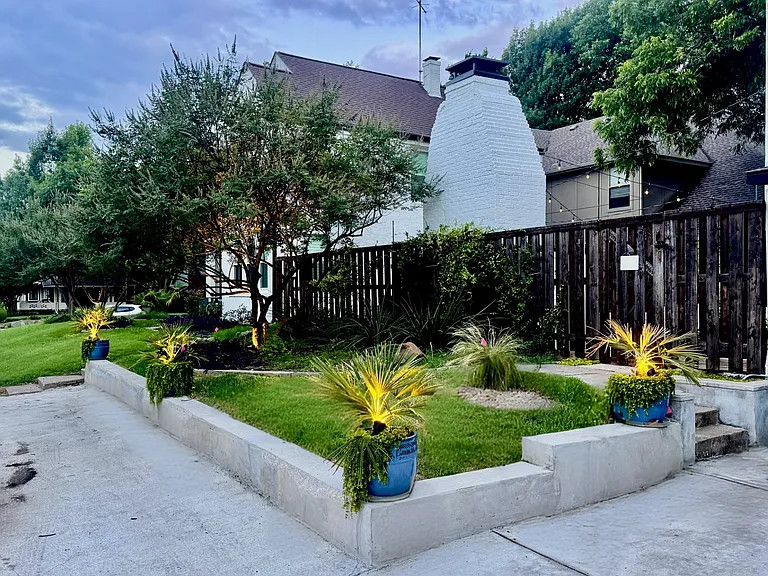 View from Alderson Avenue looking at the side street parking spots, the duplex and the 20-foot towering fireplace.