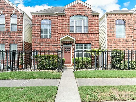 Free standing Townhome located street side in Midtown Village, a gated community