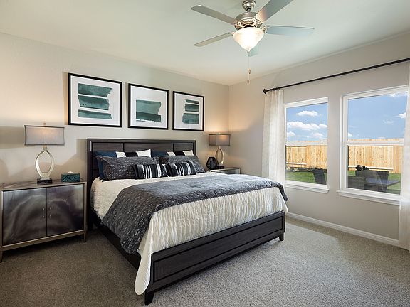 Enjoy a private primary suite tucked away in the back of the home.