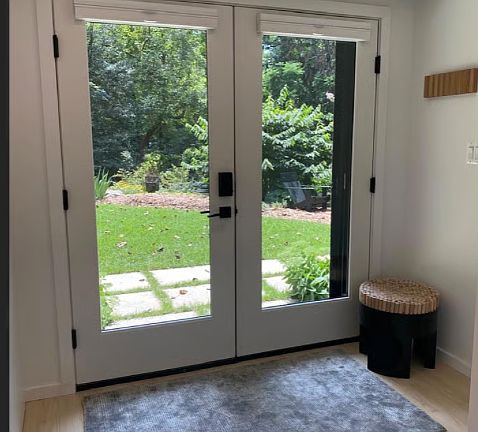 View of Private Entrance Overlooking Garden. Doors Outfitted with Custom Top Down/Bottom Up Floor to Ceiling Shades.