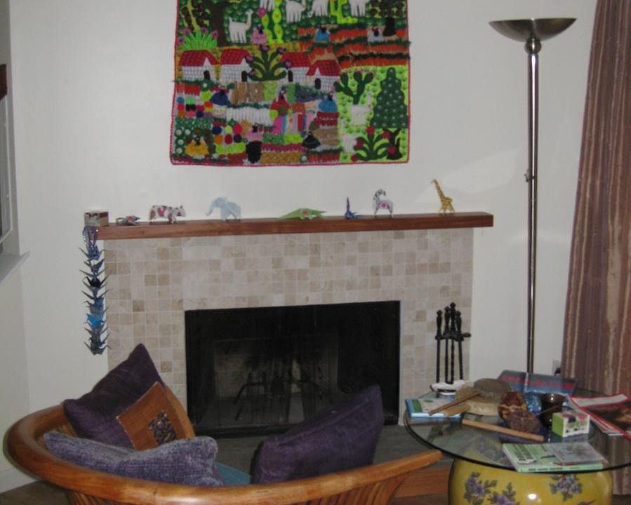 Marble tile wood burning fireplace