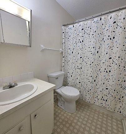 Bathroom with tub and shower combo
