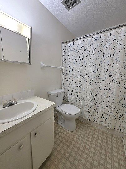 Bathroom with tub and shower combo