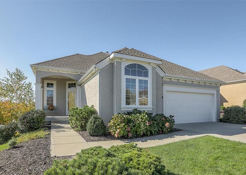 Lovely landscaped areas around entire home situated on a walk out corner lot.