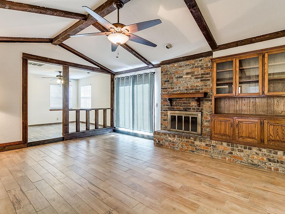 Gorgeous living room with beautiful floors, vaulted ceilings, and fireplace. Opens up to second living area, which would make a great office or play room. Available 6/1/2020, $1440 a month, Lawn Care Included.