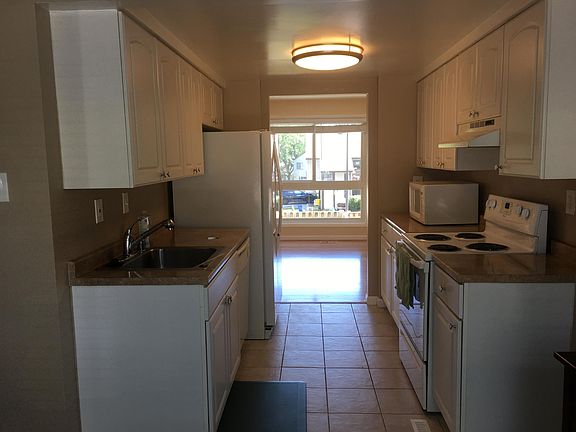 Galley kitchen w/ view out back and front