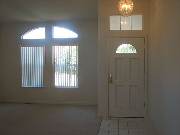 Fron Entry with high-vaulted ceilings and NEW CARPET Thru-out...