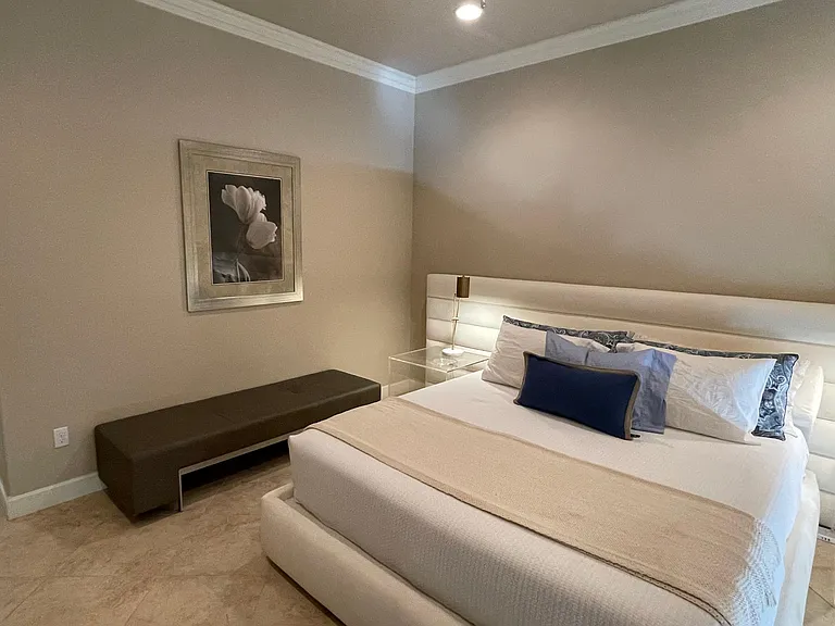Master bedroom including new modern & elegant Cal-king platform bed, side tables & bench.