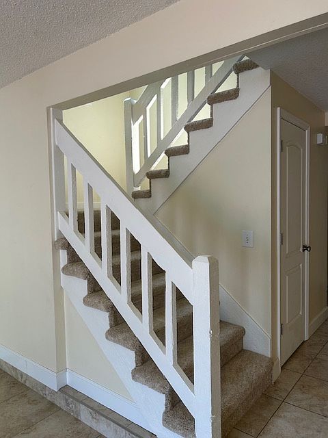 Stairs leading to upstairs 3 bedroom