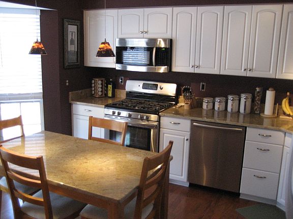 Remodeled kitchen with granite and stainless steel appliance