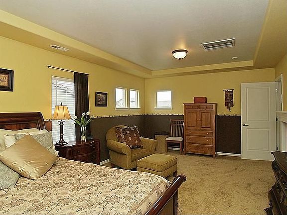 Opulent Master Bath with marble slab raised double vanities, tub, shower